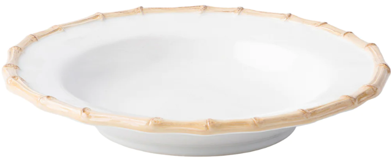 A white, shallow ceramic bowl with a bamboo-inspired rim and raised base adds casual elegance to your table as part of the Juliska Classic Bamboo Dinnerware Collection.