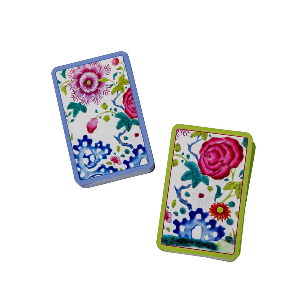 A deck of playing cards featuring beautiful flower designs by Caspari.