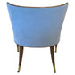 Back view of the Marino Dining Chair by McCann Design Group, featuring blue upholstery, solid walnut legs, and stylish bronze sabots.