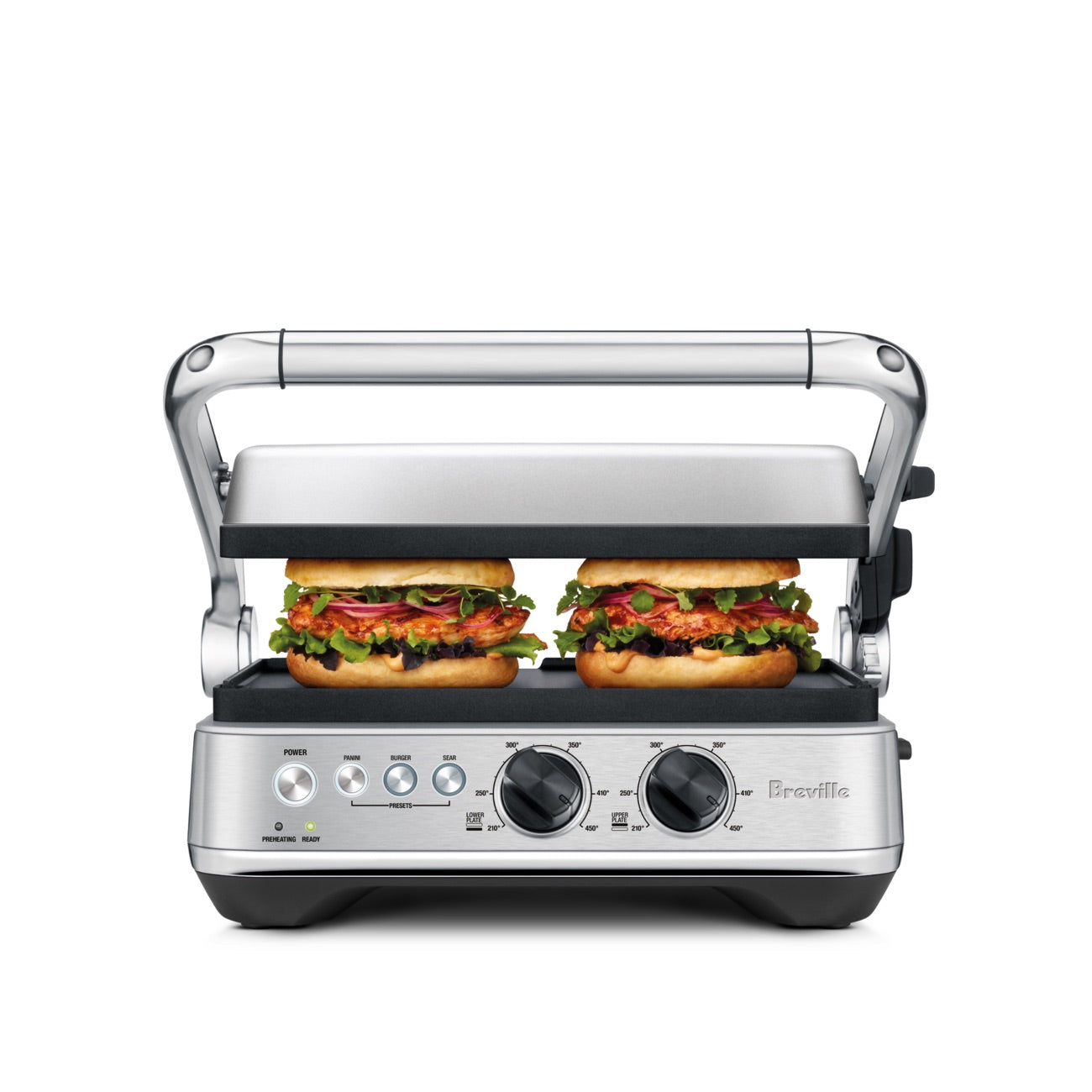 The Breville Sear & Press Grill is grilling two sandwiches; visible control knobs and indicator lights are on the front panel of this stainless steel panini press.