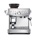 The Breville Barista Express Impress Espresso Machine, shown on a white background, features stainless steel construction, a built-in grinder, steam wand for microfoam milk, and easy control buttons.