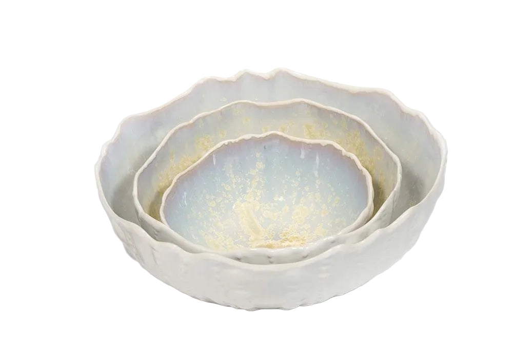 The Sea Urchin Bowl Collection by AE Ceramics features three hand-molded ceramic bowls with scalloped edges and a pale glaze—unique coastal dinnerware perfect for elevating your table. Shown on a white background.