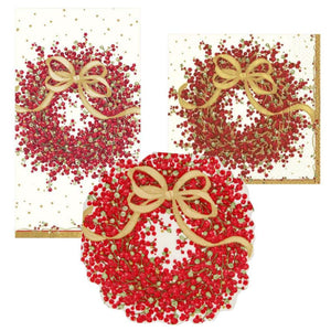 The Caspari Pepperberry Napkin Collection includes rectangular and square napkins plus a round plate, all featuring a red berry wreath with gold bow and elegant gold accents, printed in Germany with nontoxic inks.