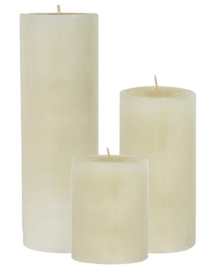 The Perin Mowen Solid Pillar Candle Collection features three unscented white beeswax candles in small, medium, and large sizes, standing upright against a white background for natural candlelight in any setting.