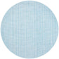The Kim Seybert Portofino Placemat features a round, light blue design with a subtle woven vinyl texture and faint intersecting lines, and is easy to clean.