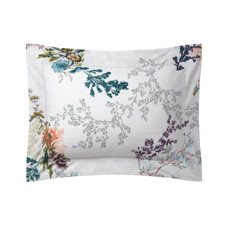 The Naiades Bedding Collection by Yves Delorme features a white pillowcase made in France with a botanical print of colorful flowers and leafy branches.