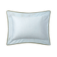 This light blue rectangular pillow from the Luciole Bedding Collection by Yves Delorme features a subtle wavy pattern, dark green trim, and is crafted from organic cotton sateen. Shown on a white background.