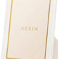 Aerin's Piero Leather Frame Collection features a white rectangular photo frame with gold detailing and a gold inner border, showcasing “AERIN” in gold at the center for an elegant display.