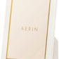 The Piero Leather Frame Collection by AERIN features a white rectangular frame with gold accents and a gold inner border—an elegant way to display cherished memories.