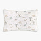 From the Dino Dreams Bedding Collection by Gooselings, this rectangular white pillow features a charming pattern of various dinosaurs, trees, clouds, and crescent moons in soft pastel colors. Crafted from breathable materials and OEKO-TEX certified, it ensures comfort and safety for your baby.