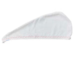The Weezie Towels Hair Towel Wrap is a white microfiber towel with a pointed end and pink zigzag edging, shown flat on a white background—ideal for customizable hair care routines.