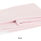A light pink Pezzo Throw from Matouk's collection, crafted from brushed cotton with a white fringe and neatly folded on a white background. Text below reads "Pink." This cozy blanket adds warmth and style to any space.