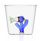 From Ichendorf Milano's Marine Garden Drinkware Collection, this clear glass tumbler features a handmade blue coral and a glass fish attached inside the bottom.