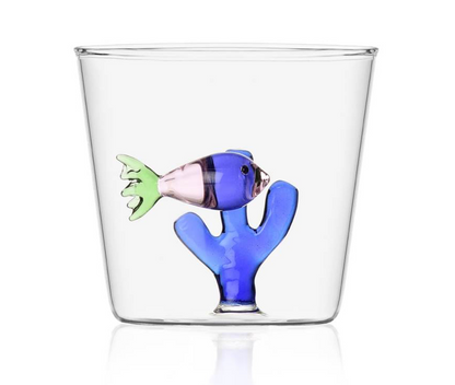 From Ichendorf Milano's Marine Garden Drinkware Collection, this clear glass tumbler features a handmade blue coral and a glass fish attached inside the bottom.