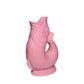 The Original Gluggle Jug’s Fish Gluggle Jug Collection features pink ceramic fish-shaped jugs with open mouths, detailed scales, and fins—an iconic British design, handmade in England.