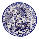 Round ceramic plate from the Pivoines Bleues Dinnerware Collection by Gien France, featuring a blue and white floral design with large Blue Peonies, leaves, and a decorative border inspired by the brand’s prestige archives.
