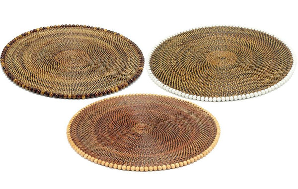 Three handcrafted Calaisio round placemats, featuring intricate spiral patterns and bordered with small wooden beads, come in rustic shades of brown and beige.