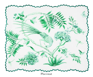 The Secret Garden Table Linen Collection by Aquazzura Casa features a white placemat with green botanical prints—bird, flowers, leaves, butterfly, and dragonfly—plus scalloped edges. Perfect to pair with matching tablecloths or napkins.