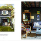 Left: The cover of “A Place To Call Home” by Rizzoli features a dark wood house with white trim surrounded by a lush garden, radiating timeless charm. Right: Inside, discover cozy living rooms with gray sofas, colorful armchairs, artwork set against dark walls, and large mirrors above lamps.