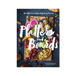 Book cover of Platters and Boards by Chronicle Books, a charcuterie board book filled with vibrant displays of fruits, nuts, crackers, and cheeses. Designed for entertaining, the cover showcases creative platter ideas. The top reads: “Beautiful, Casual Spreads for Every Occasion.”.