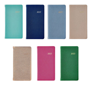 Seven Graphic Image 2027 Pocket Datebooks in a variety of colors—teal, navy, light blue, beige, gold, pink, and green—are displayed in two neat rows on a white background. Ideal as a personal pocket journal or compact pocket diary, these planners are thoughtfully designed to help keep you organized all through 2027.