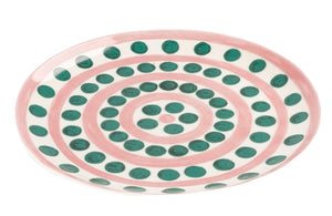 Themis Z Symi Green and Pink Collection oval fine porcelain plate with a pink base and concentric circles of green dots.
