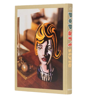 This "Pop Art Style" book by Assouline features a cover image of a sculpture with a woman's face, blending realistic and comic elements reminiscent of 1960s and ’70s pop culture.