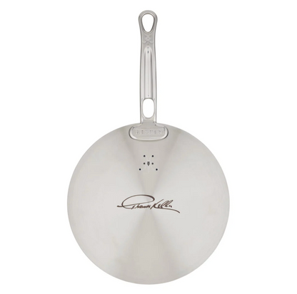 The Hestan Commercial Clad Stainless Steel Universal Lid, 11", features a sleek silver design with a handle and has an engraved signature on its stainless steel underside.