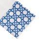 The Cane Bath Collection by Haute Home features white Italian linen fabric adorned with a blue geometric embroidery pattern of interlocking shapes on one end, making it perfect for an elegant tip towel or tissue box cover.