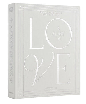 The PrintWorks "A Story of Love Wedding Album" is a hardcover photo album with embossed white text and decorative borders on a light gray cover, ideal for preserving your wedding day memories.