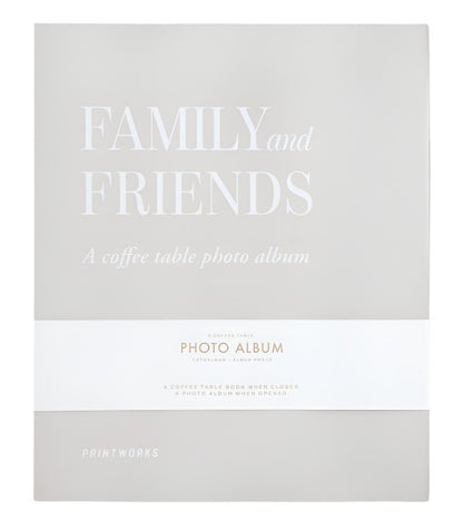 Front cover of the Family and Friends Photo Album by PrintWorks, showcasing a minimalist beige design with white text and stylish photo storage on high-quality black photo paper.