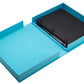 The PrintWorks Life Is A Journey Photo Album features a turquoise three-ring binder with a cloth cover and black interior, perfect for displaying memories as a coffee table photo album. High-quality design lies flat, ready to be filled.
