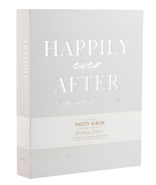 An elegant light grey cover with the text "Happily ever after" and "A coffee table photo album" embossed on it, the PrintWorks Happily Ever After Photo Album is perfect for preserving your wedding day memories. The title is cut out, revealing a charming beige background ideal for showcasing your special moments.