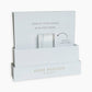 A white display stand, branded Anne Neilson Home, features the message "DISPLAY YOUR ANGELS WITH THIS STAND" and "REMOVE FROM CARD." It's perfect for holding Anne Neilson: Promise Scripture Cards, angel paintings, or reminders of God's promises.