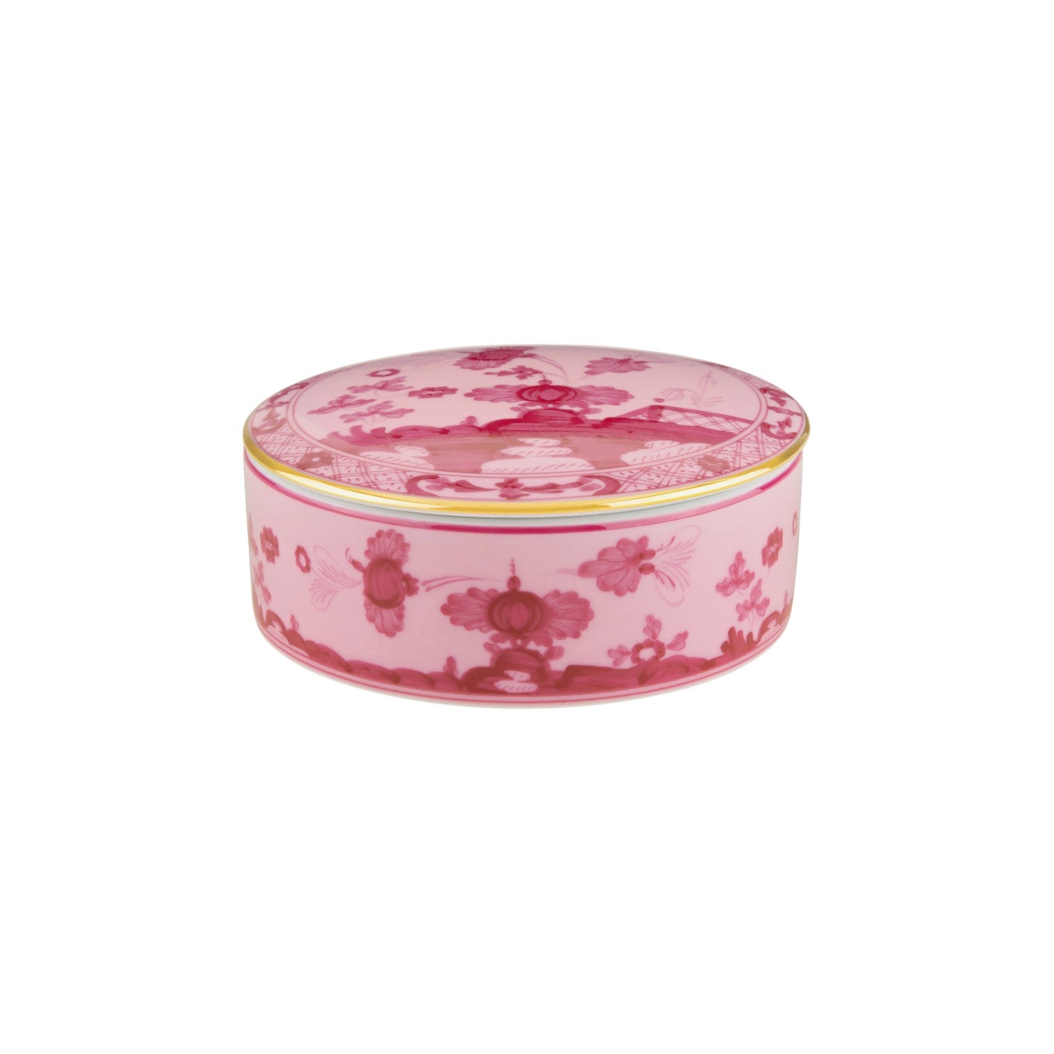 The Oriente Italiano Porpora Dinnerware Collection from Ginori 1735 features round, pink porcelain pieces with lids, adorned with floral patterns and gold rims, reflecting classic Italian elegance.