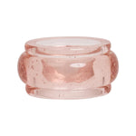 The Provence Napkin Ring Collection by Juliska features translucent, light pink glass rings with rounded edges and tiny air bubbles, reminiscent of bubbly glassware—perfect for Provence-inspired table settings. Displayed on a white background.