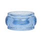A translucent blue resin napkin ring from the Provence Napkin Ring Collection by Juliska features a wide band and small air bubbles inside, echoing the look of bubbly Provençal glassware.