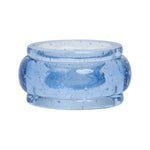 A translucent blue resin napkin ring from the Provence Napkin Ring Collection by Juliska features a wide band and small air bubbles inside, echoing the look of bubbly Provençal glassware.