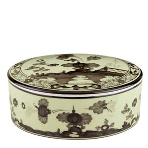 A round porcelain box with lid from the Oriente Italiano Bario Decor Collection by Ginori 1735, featuring intricate black floral and geometric patterns on a cream background reminiscent of classic Oriente Italiano dinner plates.