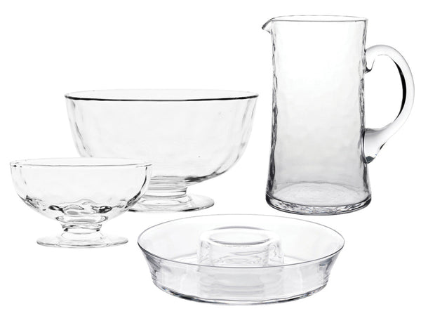 Explore the Juliska Puro Glass Serveware Collection by Juliska, a chic set of mouth-blown glassware including a pitcher, two bowls, and a plate, beautifully showcased on a plain white background.