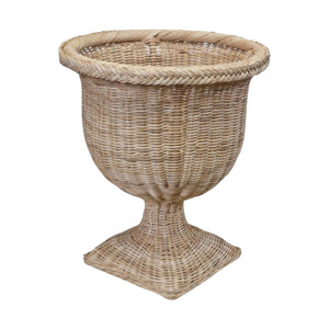The Braided Square Base Urn by Mainly Baskets Home features an urn shape with a wide round opening, curved body, and a sturdy wicker pedestal square base.