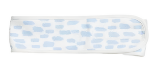 The Weezie Towels Spa Headband is a white microfiber headband with irregular light blue rectangles, adjustable Velcro, and is shown laid flat on a white background.