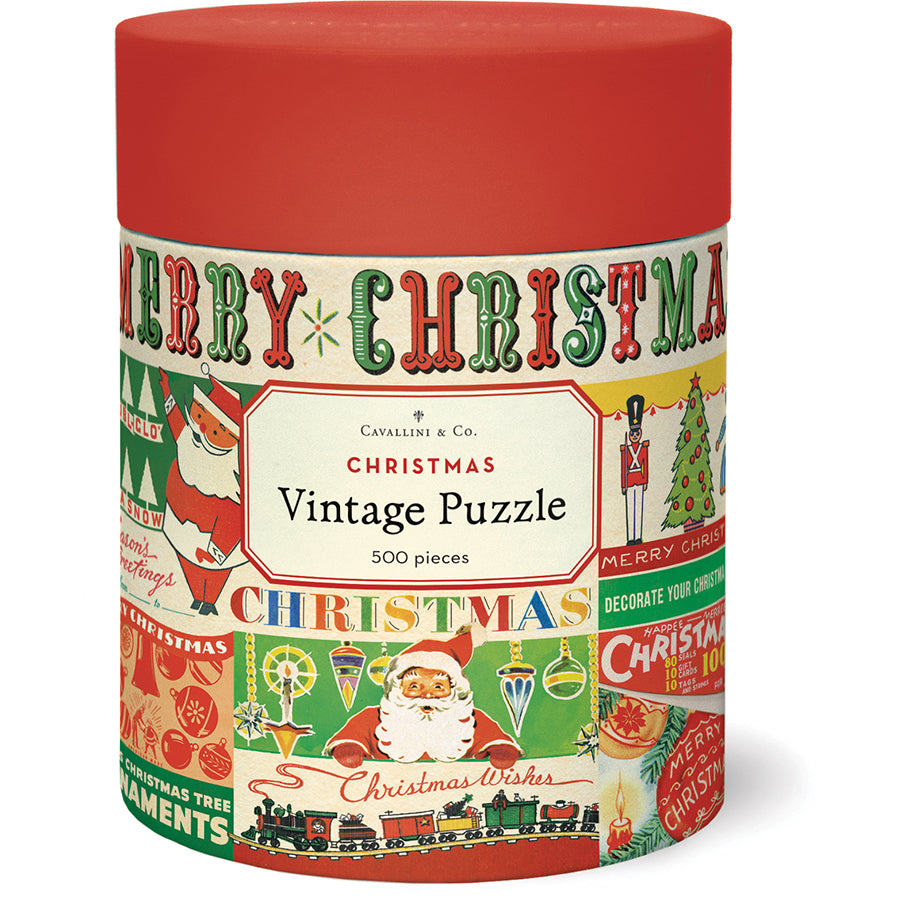 The Vintage Christmas 500 Piece Puzzle by Cavallini Papers and Co comes in a cylindrical container with vintage Christmas graphics like Santa, ornaments, and "Merry Christmas"—perfect for holiday fun.