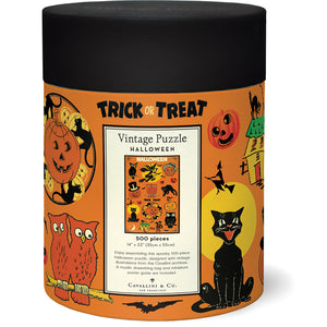 The Cavallini Papers and Co Halloween Vintage 500 Piece Puzzle comes in a cylindrical box labeled "Trick or Treat" with vintage owl, black cat, and jack-o'-lantern art inspired by the Cavallini archives.