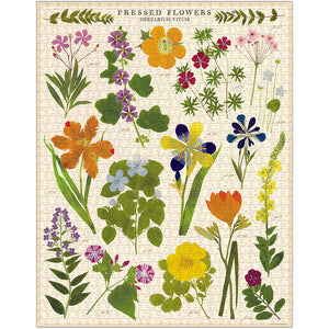Featuring illustrations of pressed flowers and green leaves from Cavallini Papers and Co, the Pressed Flowers 1,000 Piece Puzzle displays "Pressed Flowers Herbarium Vivum" at the top—a beautiful puzzle for any flower enthusiast.
