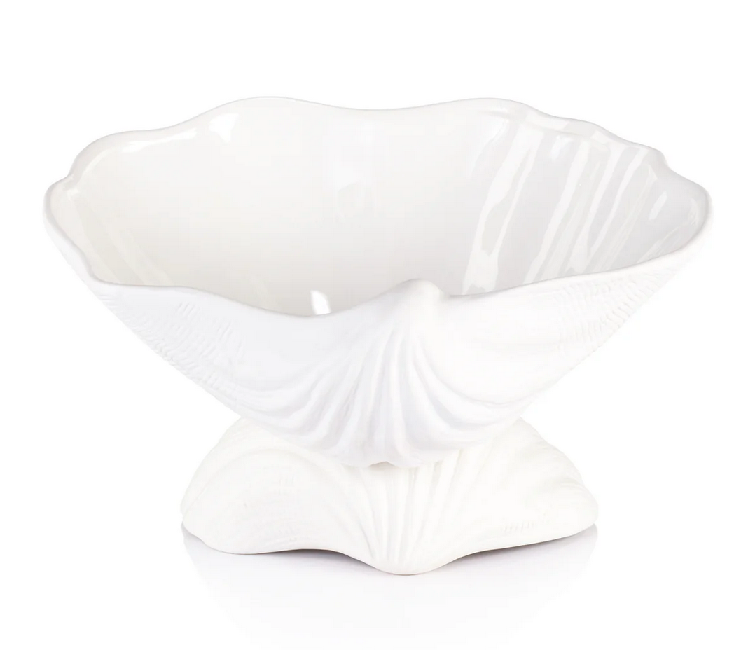 The La Coquille Stoneware Clam Shell Bowl by Zodax boasts a glossy white finish, wide wavy rim, and shell-patterned base—an elegant coastal accent for any room.