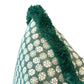 Close-up of the Boheme Green Outdoor Pillow by Associated Design, featuring a white circular pattern and dark green fringed trim, crafted from premium materials.