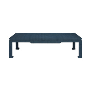 The Wylder Coffee Table by Made Goods is a rectangular blue piece featuring a high gloss linen-textured surface and four straight legs, shown from the front against a white background.