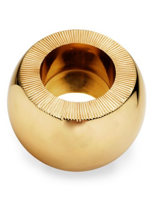 The Aerin Sphere Match Striker is an artisanal, round, gold-colored piece with a wide central opening and fine ridged rim detailing, reminiscent of sand-cast brass.
