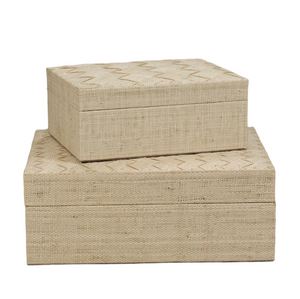 The La Bocca Woven Raffia Box Collection by Zodax features two rectangular raffia boxes stacked together, offering artisanal charm and stylish storage for any space against a plain white background.